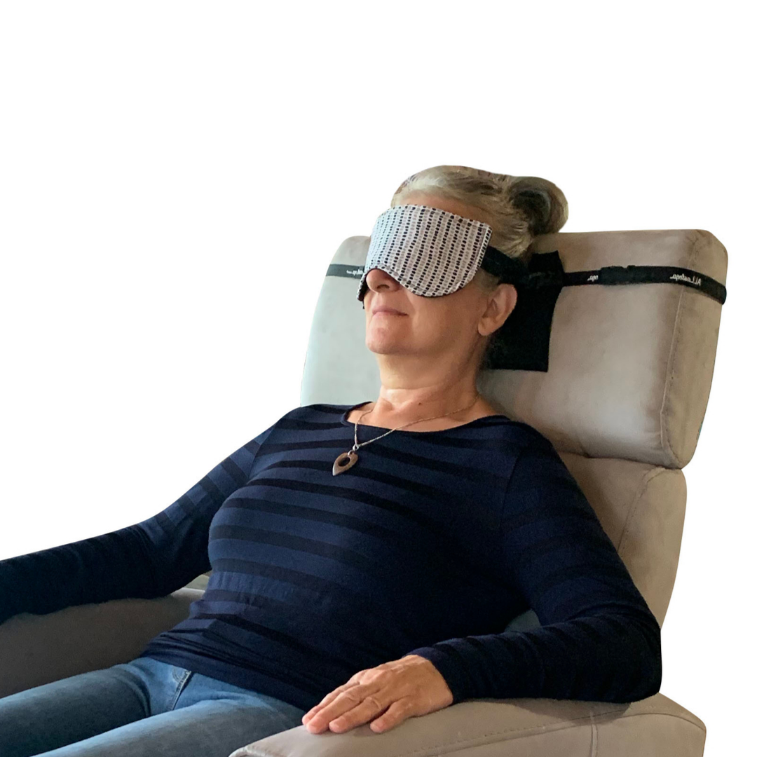 Woman sleeping in a recliner style chair with ALLasleep and extension